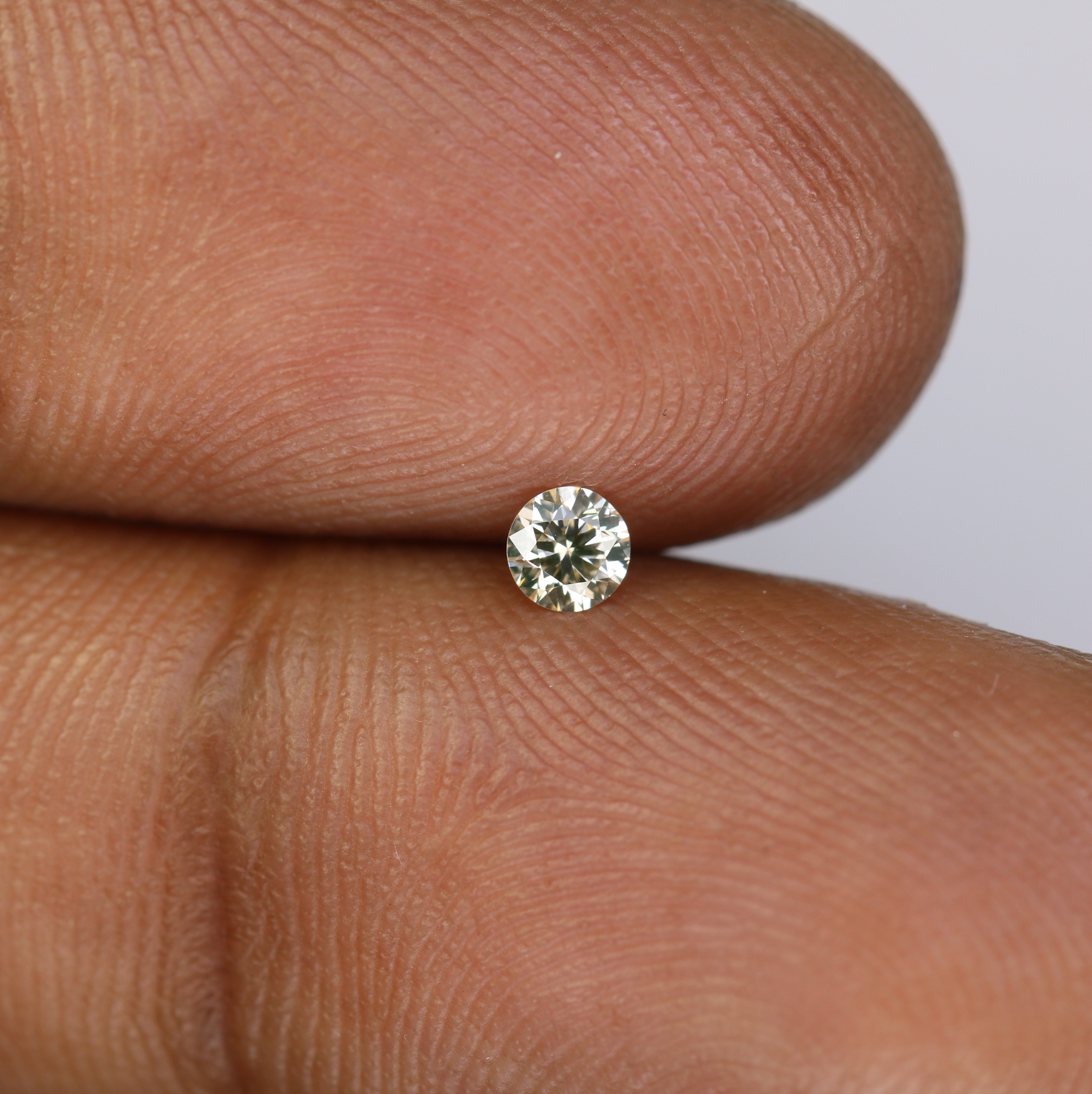0.13 CT Round Brilliant Cut Light Yellow Diamond For Engagement Ring